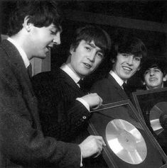 the beatles are holding up their record