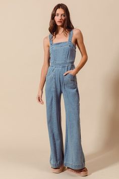 Say hello to your new summer staple, the Cassidy Jumpsuit! This light wash denim jumpsuit features a sleeveless design with thick shoulder straps for comfort and style. Complete with side pockets and a back zipper closure, and a wide leg silhouette for a trendy touch. Details + Fit 68% Cotton | 30% Polyester | 2% Spandex Runs True to Size Machine Wash Cold Hang To Dry Square Neckline Sleeveless Back Zipper CLosure Side Pockets Wide Leg Light Wash | Solid Model is 5'8" and wearing a size Small Spring Washed Blue Overall Jumpsuits And Rompers, Washed Blue Overall Jumpsuits And Rompers For Spring, Spring Denim Overall Jumpsuit In Medium Wash, Spring Washed Blue Overalls, Spring Medium Wash Overall Jumpsuits And Rompers, Summer Denim Bib Front Jumpsuit, Summer Bib Front Denim Jumpsuit, Spring Medium Wash Cotton Jumpsuits And Rompers, Spring Cotton Medium Wash Jumpsuits And Rompers