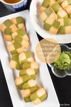 matcha cheesy shortbread cookies on plates next to a cup of green tea