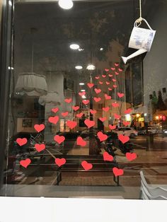 the window is decorated with red hearts