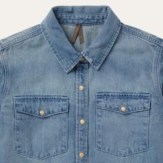 A looser take on a Stetson classic, this light denim snap-front shirt features oversized snap-front patch pockets at the chest, and is lightly distressed for a worn-in feel, including a raw-edge hem at the cuffs. Finished with single point front and back yokes and single-snap cuffs. 100% Cotton Single Point Back Yoke Single Snap Cuffs Imported Classic Denim Top With Pockets In Medium Wash, Classic Light Wash Denim Top, Light Wash Chambray Denim Jacket With Button Closure, Classic Medium Wash Chambray Denim Top, Relaxed Fit Light Wash Shirt With Snap Buttons, Light Wash Shirt With Snap Buttons And Relaxed Fit, Classic Washed Blue Denim Top With Pockets, Classic Light Wash Denim Top With Pockets, Unstructured Medium Wash Top With Pockets