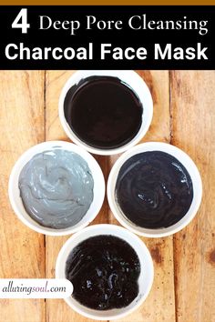 four bowls filled with different types of charcoal face mask on top of a wooden table