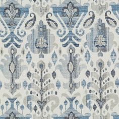 a blue and white fabric with an ornate design