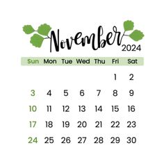 a calendar with the word november in green and black ink on it, sitting next to a