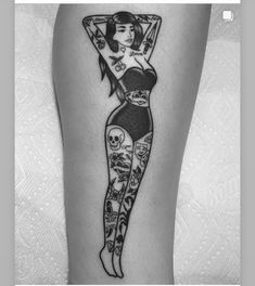 a woman with tattoos on her leg