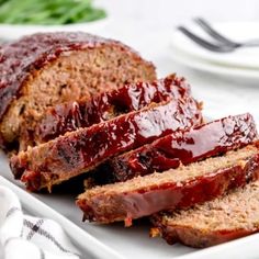 slices of meatloaf on a plate with ketchup