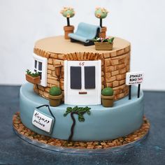 a cake with a small house on top of it