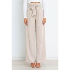 These wide-leg pants are a timeless classic that look as good with a blazer and heels as they do with a casual t-shirt. The high waist and gathered pleated waistband give these trousers an ultra- flattering shape while the functional zip and hook and eye clasp keep your look secure. For added convenience there are belt loops, plus a detachable waist tie to customize your fit. And last but not least, two functional pockets make them practical too! Whether you’re looking for something dressy or ju Wide Leg Suit Pants, Long Pants Casual, Casual Tie, Blue Khakis, Pantalon Large, Suit Pants, White Beige, Long Pants, Black Pants