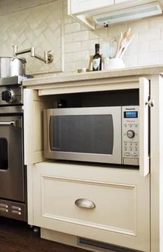 a microwave oven sitting on top of a kitchen counter