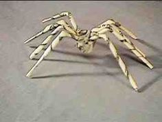 a wooden spider sculpture sitting on top of a table