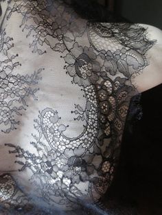 the back of a mannequin with black lace on it