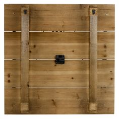 a wooden fence with two black latches on the top and bottom bars that are attached to each other