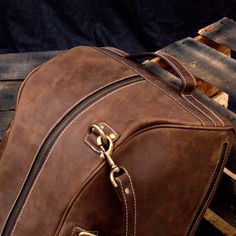 "DIMENSIONS: 10.5\"H x 19\"L x 10.5\"D x | 26.5 cm H x 48 cm L x 26.5 cm D CAPACITY : 34 L This Comfortable Leather Duffel Bag is the ultimate rebirth of antique style weekender bags. We designed it with high quality leather from cowhide. This luggage overnight travel bag is designed to keep all your essentials centralized for a weekend. This travel handbag lets you work on-the-go with its extra laptop pocket having special cushion protection to keep your MacBook/Laptop safe. We made sure that i Leather Overnight Bag, Leather Bag Design, Overnight Travel Bag, Leather Duffel Bag, Leather Weekender Bag, Leather Duffel, Leather Weekender, Macbook Laptop, Weekend Travel