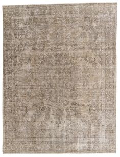 an antique rug with faded colors and patterns on the bottom, in neutral tones that appear to have been worn over time