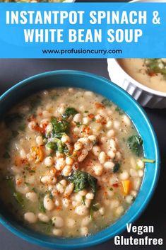 white bean soup with spinach and carrots in a blue bowl