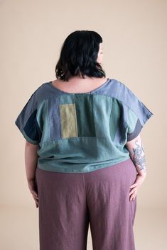 Add some fun to your wardrobe with the Patchwork Painter Top, a best-seller designed for both style and comfort. Featuring a relaxed, boxy fit, this top drapes beautifully, offering a flattering silhouette that complements any body type. Its versatile design makes it a seasonal staple, perfect for layering through fall and beyond. Crafted with love by Olivia + Esme, each top is made from carefully curated fabric scraps collected throughout the year, making every piece unique. Oversized Patchwork Tops For Layering, Relaxed Fit Summer Tops With Patchwork, Oversized Patchwork Short Sleeve Tops, Relaxed Fit Short Sleeve Patchwork Blouse, Lagenlook Patchwork Top With Relaxed Fit, Versatile Oversized Green Top, Lagenlook Relaxed Fit Patchwork Tops, Green Relaxed Fit Blouse For Layering, Jumpsuit And Cardigan