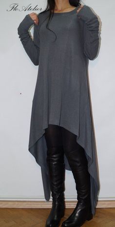 "This sweater has long panels outlining the asymmetric fluted hem. It is crafted from luxury and soft wool acryl blend. Cut for an oversized fit, with dropped shoulders, which add to the relaxed feel of this piece. Absolutely must-have sweater dress! Echo it's effortless feel with skinny denim or with your favorite leggings. Add unique touch in your everyday life. MATERIALS: - wool acryl blend ------------------------------- If you have any questions about the item or have any personal requireme Gray Stretch Sweater Dress For Fall, Stretch Dress With Asymmetrical Hem For Fall, Casual Asymmetrical Fall Dresses, Casual Long Tunic For Fall, Fall Lagenlook Dress With Asymmetrical Hem, Casual Asymmetrical Dress For Fall, Fall Layering Dresses With Crew Neck, Fall Asymmetrical Tunic, Casual Winter Dress With Asymmetrical Hem