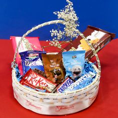 a basket filled with assorted candy and snacks