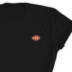 Fish Clownfish Shirt, Clownfish Lover T-shirt, Fish Lover Shirt, Ocean Lover Simple T-shirt, Clownfish Lover Gift, Fish Unisex T-Shirt, Fish Take this one by your side everywhere. Friends will love it! This t-shirt feels soft and lightweight, with the right amount of stretch. It's comfortable and flattering for both men and women. * 100% cotton (heather colors contain polyester) * Fabric weight: 5 oz * Shoulder-to-shoulder taping * Side-seamed Time for Delivery: * Processing & production tim Cute Anteater, Cat Dad Shirt, Shirt Cake, Sloth Shirt, Fruit Shirt, Monkey Shirt, Strawberry Shirt, Monkey T Shirt, Minimalist Shirts