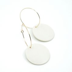 "Handmade Minimalist Porcelain and 14k Gold Plated Hoop Earrings. Each porcelain earring is handmade and glazed by hand. Due to the handmade nature of these earrings, they may vary slightly in shape, color and pattern. + Length: 2-1/4\" + Width: 1\" + All Earrings are Final Sale - I try to make sure that the colors represented are as close to true as possible, but please remember that colors may differ slightly from what your monitor displays. - Please note that porcelain jewelry is breakable. W White Round Hoop Earrings, Minimalist Small Hoop White Jewelry, Minimalist White Round Hoop Earrings, White Minimalist Round Hoop Earrings, Modern White Nickel-free Hoop Earrings, Nickel-free White Circle Hoop Earrings, White Nickel Free Hoop Earrings, Nickel Free White Circle Hoop Earrings, Minimalist Small White Hoop Earrings