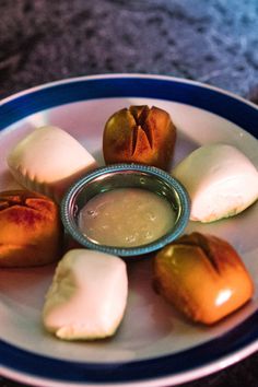 some food on a white plate with blue trim