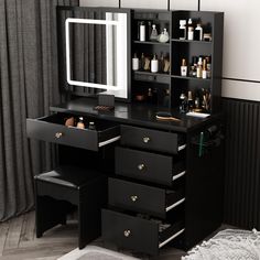 a black vanity with drawers and a mirror