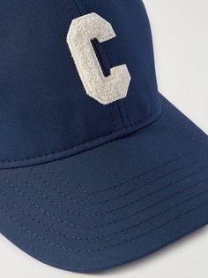 CELINE HOMME's baseball cap is a Parisian take on classic varsity style. It's been made in France from cotton-gabardine and appliquéd with a terry initial at the front, so you can rep it like your favourite team. Classic Baseball Cap With Logo Patch Visor, Classic Navy Baseball Cap With Curved Visor, Classic Curved Brim Baseball Cap For College, Collegiate Six-panel Baseball Cap For College, Navy Curved Visor Baseball Cap For Baseball Season, Six-panel Baseball Cap With Embroidered Logo For College, Classic Navy Baseball Cap For Sports Events, Classic Navy Hat With Curved Visor, Blue Collegiate Six-panel Baseball Cap