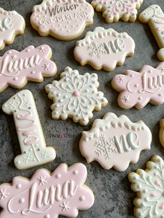 decorated cookies are arranged on a table