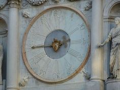 a large clock on the side of a building