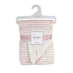 a pink and white striped blanket on a hanger