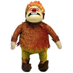 a large stuffed animal with orange hair and red nose, wearing gold glitters on it's body