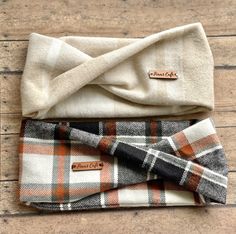 three plaid bow ties laying on top of each other