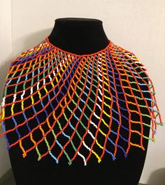 Beautiful, Multicolored beaded Egyptian/African/Multicultural Collar Necklace. Made of intricate seed beads with an adjustable ball closure. Necklace length 16 inches, Height 8 inches, Width 26 inches. Traditional Colorful Beads Bib Necklace, White Beaded Choker For Festivals, Festival Beaded Choker, Multicolor Traditional Bib Necklace With Large Beads, Festival Choker With Colorful Beads, Festival Beaded Choker With Round Beads, Festival Choker With Colorful Round Beads, Artisan Multicolor Beaded Necklace, Traditional Bib Necklace With Round Beads