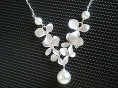 Dangling Triple Orchids Flowers Necklace 2 by LaLaCrystal on Etsy, $25.50 Elegant White Bridal Necklace For Bridesmaid, White Flower Bridal Necklace For Wedding, White Floral Bridal Necklace For Wedding, Silver Flower Bridal Necklace For Wedding, Elegant Silver Flower Bridal Necklace, Elegant White Flower Bridal Necklace, Pearl White Flower Necklaces For Wedding, Delicate Silver Bridal Necklace For Bridesmaids, Orchid Necklace