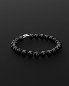 Experience simplicity at its finest with the Essential Bracelet. This piece embodies the elegance of minimalism, crafted for those who find beauty in understatement. It's a subtle yet powerful expression of self, perfect for visionaries who appreciate the grace in simplicity and make their mark with a quiet yet impactful presence. All our stones are chosen by hand to satisfy AAA quality standards. They are natural stones and their size and color can vary slightly. Stone: AAA Grade 8mm Metal: 925 Minimalist Formal Bracelets With Sterling Silver Clasp, Minimalist Formal Bracelet With Sterling Silver Clasp, Everyday Luxury Sterling Silver Polished Bracelets, Elegant Black Bracelets For Everyday, Black Bracelets With Sterling Silver Clasp, Black Jewelry With Sterling Silver Clasp For Everyday, Everyday Black Jewelry With Sterling Silver Clasp, Minimalist Sterling Silver Pearl Bracelet, Timeless Bracelet With Sterling Silver Clasp