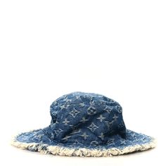 This is an authentic LOUIS VUITTON Monogram Denim Fringe Bob Bucket Hat size M in Blue. This stylish cap is crafted of cotton with blue and white Louis Vuitton monogram print throughout with fringe trim. The underside black nylon interior. Fringe Bob, Denim Fringe, White Louis Vuitton, Stylish Caps, Monogram Prints, Fringe Trim, Black Nylon, Black Nylons, Hat Sizes