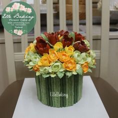 a cake decorated with flowers on top of a table