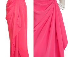 "This vintage Loris Azzaro evening gown is made of a bright pink jersey and features a fitted bodice with light boning and beautifully gathered and pleated fabric that is hand stitched into place. Perfectly draped fabric forms the skirt. The dress closes with a hidden back zipper and a metal hook and eye. No material tag, probably 100% silk. Made in France. The reference picture shows Marisa Berenson in a very similar Loris Azzaro dress. Photo by Michael Holtz, 1972. Condition Excellent. Size No Pink Ruched Pre-draped Evening Dress, Pink Ruched Evening Dress For Formal Occasions, Pink Ruched Draped Evening Dress, Pre-draped Pink Evening Dress For Cocktail, Spring Pink Pleated Evening Dress, Pink Ruched Evening Dress For Spring, Fitted Pink Evening Dress With Ruched Bodice, Pink Draped Dresses With Pleated Bodice, Pink Pleated Evening Dress For Formal Occasions