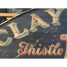 an old sign that says clay hustle