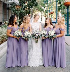 the bride and her bridesmaids are all dressed in lavender colored chiffon dresses