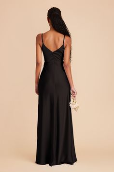 the back of a woman in a black dress