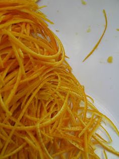 shredded carrots sitting on top of a white plate