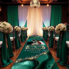 the aisle is decorated with green satin and gold trimmings for an elegant wedding