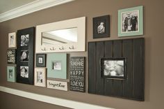 a wall filled with pictures and framed photos