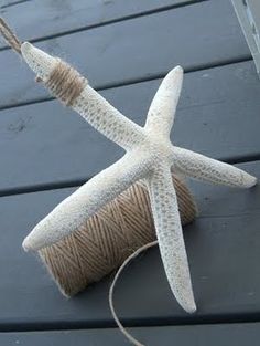 a spool of twine with a starfish on it