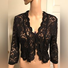 Back Lace Cardigan, Brand New Never Worn. This Lovely Lace Will Accent Any Outfit. Elegant Black Sweater For Evening, Elegant Black Evening Sweater, Fitted Black Cardigan For Evening, Elegant Fitted Cardigan For Night Out, Elegant Black Cardigan For Night Out, Elegant Black Party Sweater, Elegant Fitted Black Cardigan, Elegant Open Front Winter Tops, Elegant Black Shrug For Spring