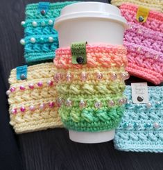 coffee cup cozyies are sitting next to each other