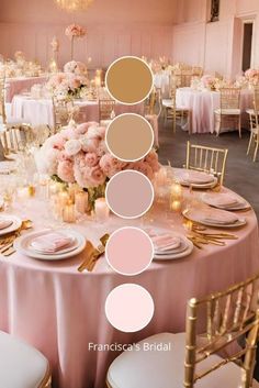 the table is set with white and pink flowers, gold chargers, candles, and plates