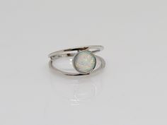 Vintage Sterling Silver White Opal Ring ...Marked 925...Total of weights 2.2grams...Size 7...Measure of stone center 10.2MM...It's in very good condition. A White Gold Sterling Silver Opal Open Ring, Adjustable Silver Rings With Round Stone, Silver Sterling Silver Opal Ring, Adjustable Nickel-free Silver Opal Ring, Sterling Silver White Gold Opal Ring, Sterling Silver Opal Ring In White Gold, Sterling Silver Opal Ring With Polished Finish, Sterling Silver Opal Ring With Round Stone, Sterling Silver Opal Ring In White Gold, Round Shape