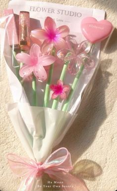 a bouquet of pink flowers in a wrapper